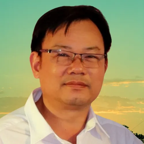 Smiling woman wearing white and black pinstriped collared top